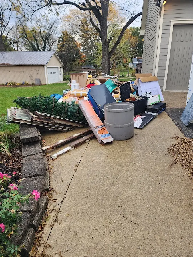 Dumpster being loaded with debris for 30 Yard Dumpster Rental in Morganfield